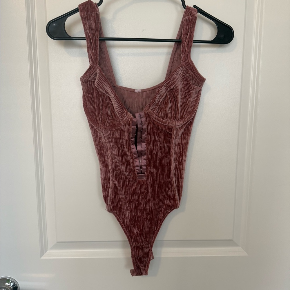 Urban Outfitters pink velvet corset body suit